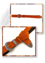 Orange suede leather belt with an embossed silver metal buckle and loop