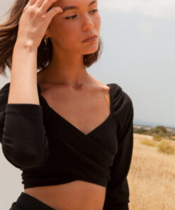 Close-up portrait of model in Lila Black Wrap Top – Mallory The Label