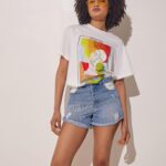 Maiden high waisted denim shorts in medium blue wash by THE KNLs worn front view