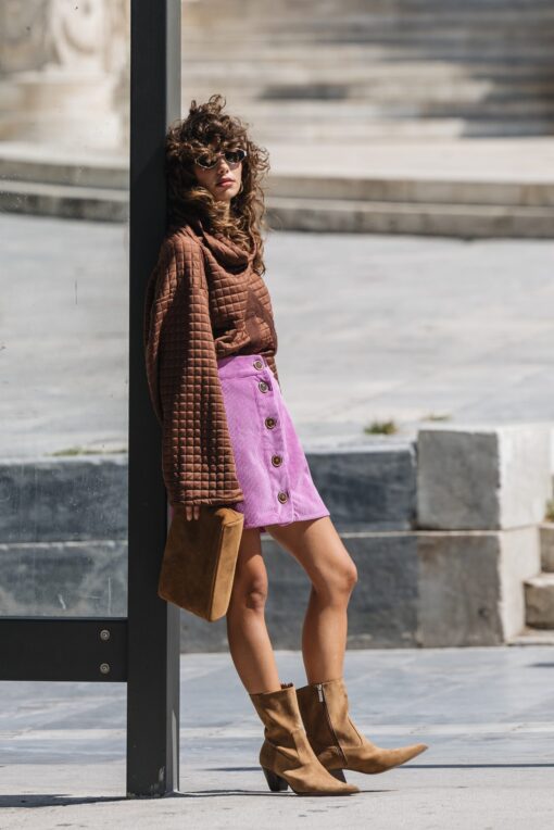 Model wearing The Wait Sweatshirt by Atheras Clothing in quilted brown fabric